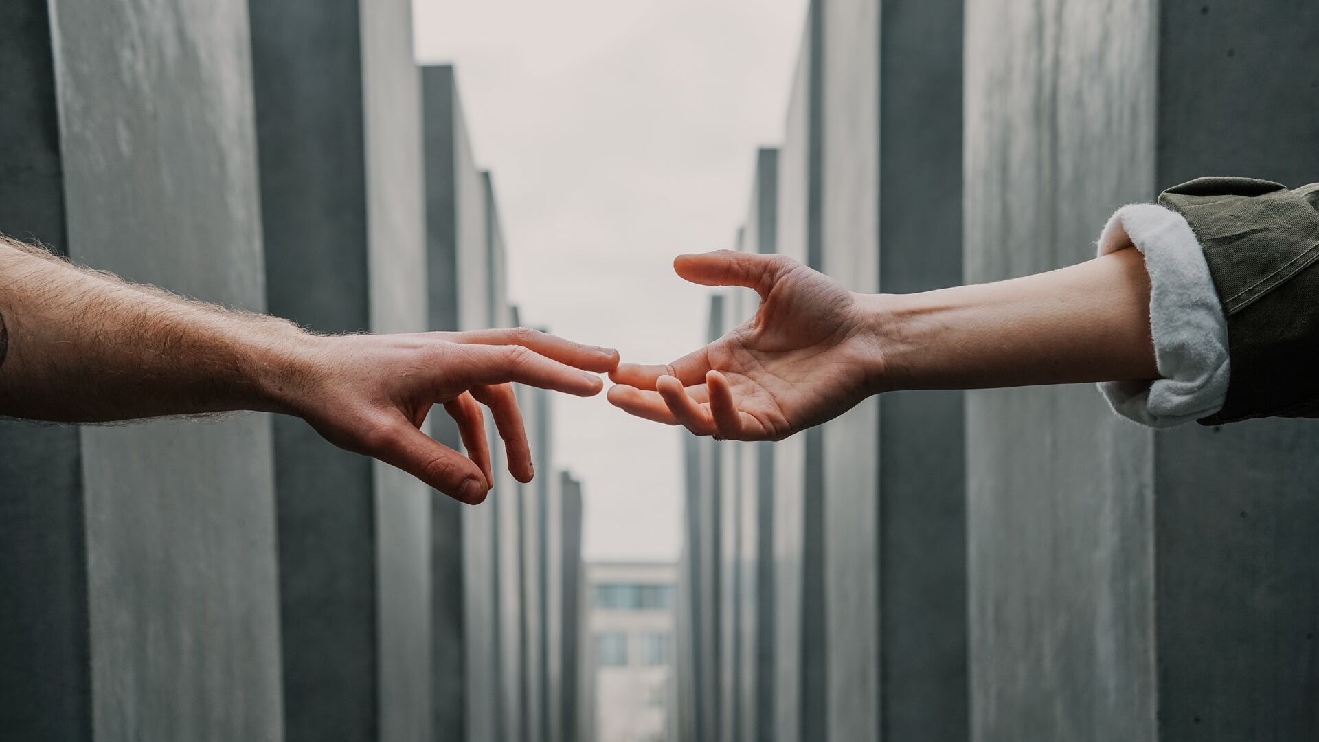 Mental Health: Two hands reaching out to each other