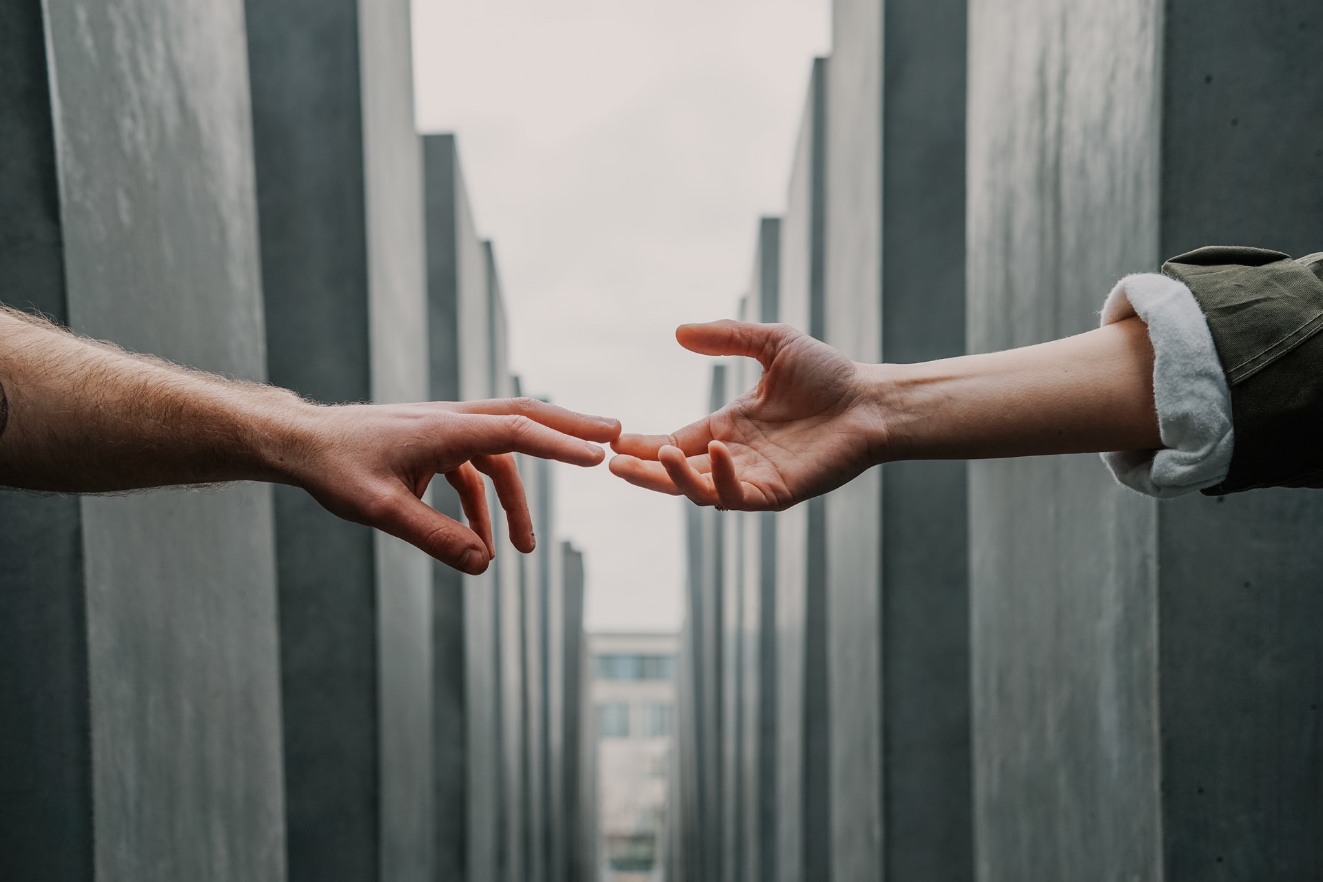 Mental Health: Two hands reaching out to each other