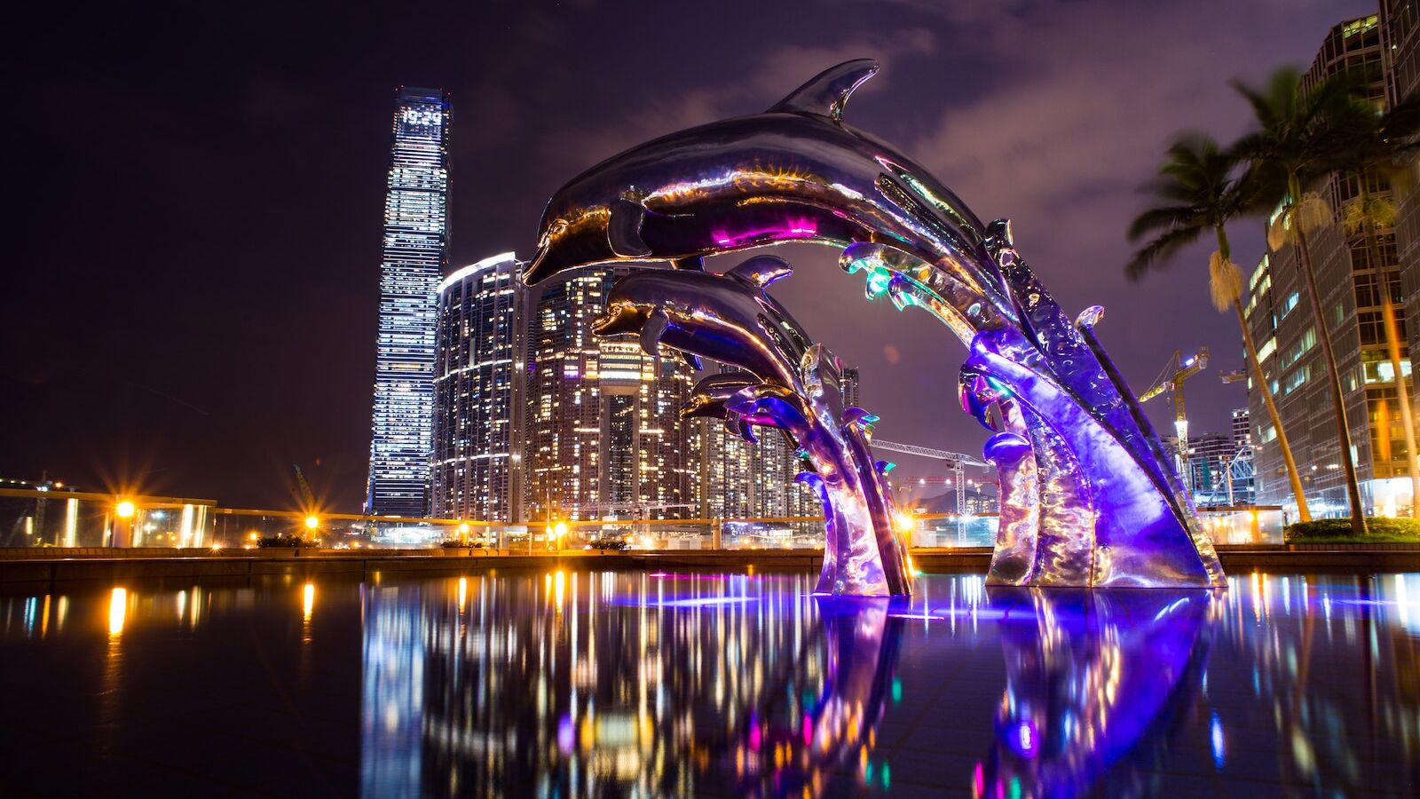 Low Angle Photography of Dolphin on Fountain