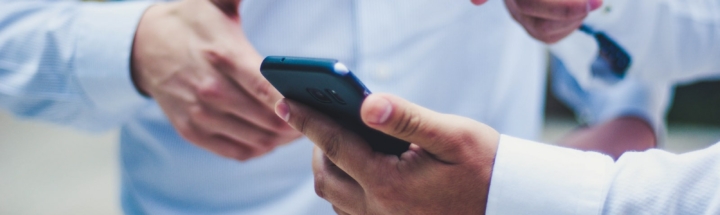 person holding black smartphone