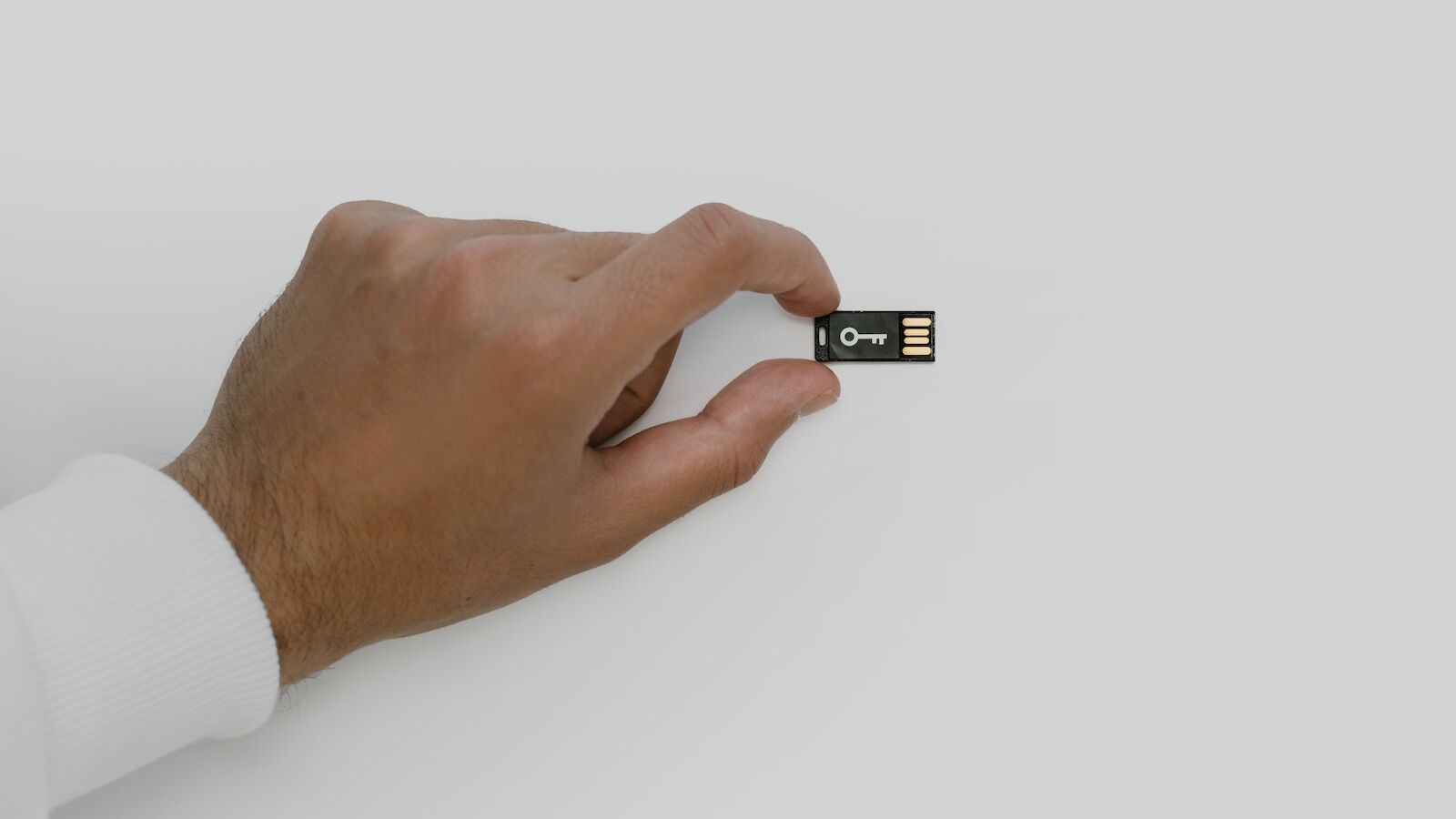 Hand Holding a USB Flash Drive