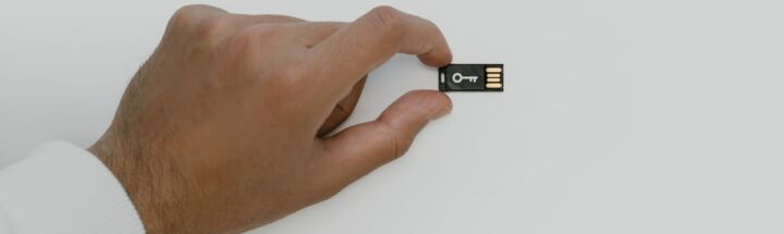 Hand Holding a USB Flash Drive
