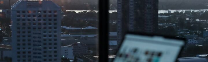 white and black high rise buildings during sunset