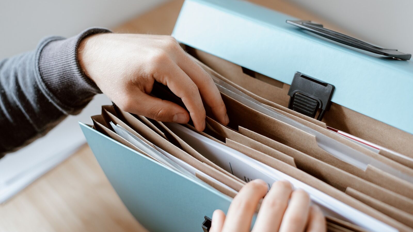 Person choosing document in folder