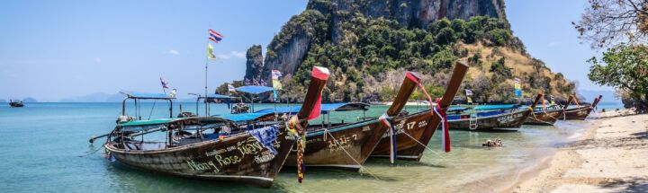 brown boat on beach during daytime