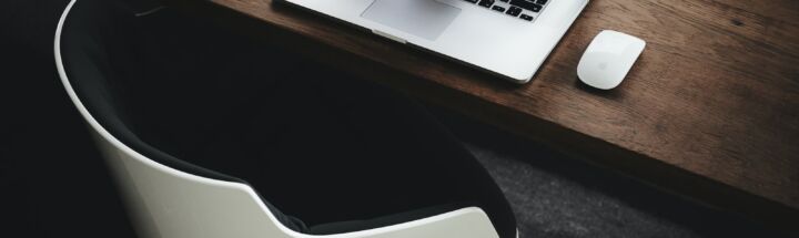 Apple MacBook beside computer mouse on table
