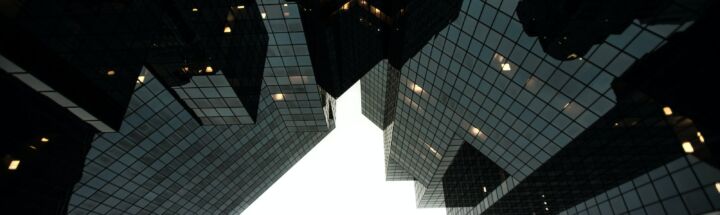 low-angle photography of building during daytime grayscale photography