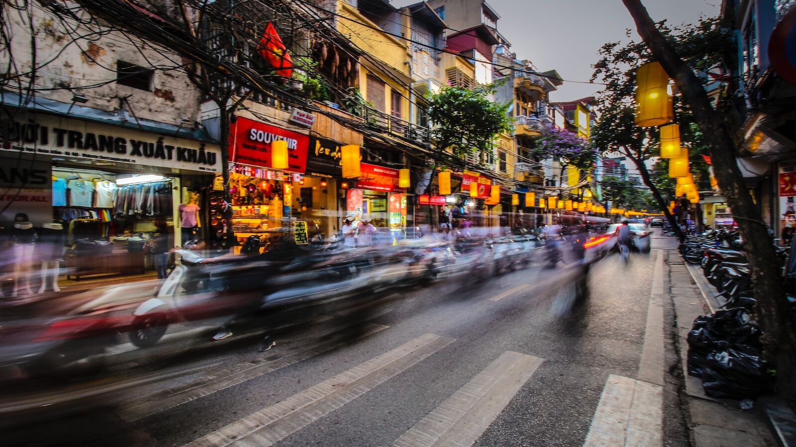 time lapse photography of vehicle towards pedestrian lane