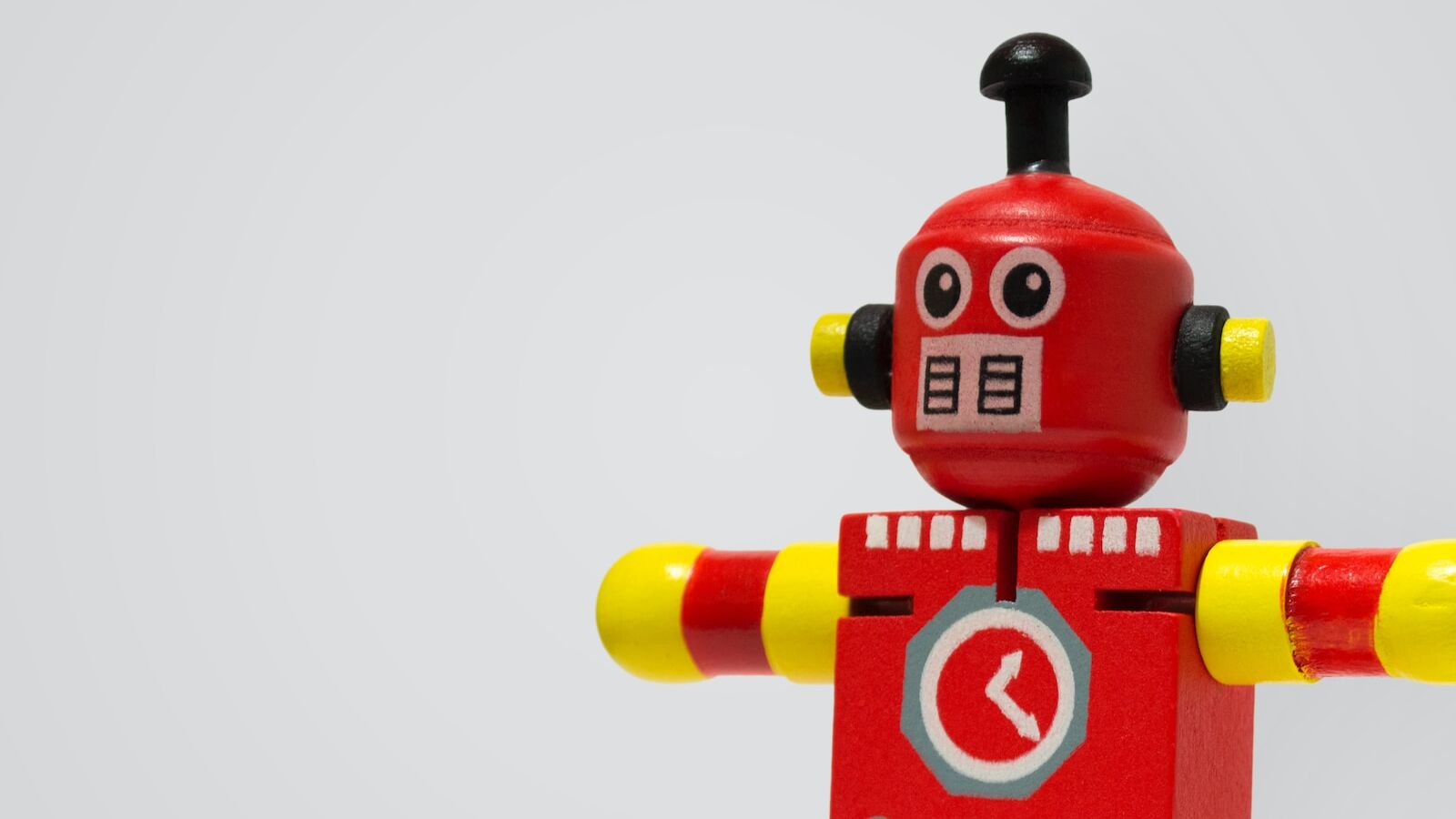 red and yellow robot clock toy