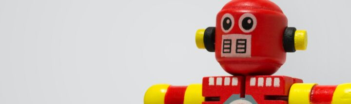 red and yellow robot clock toy