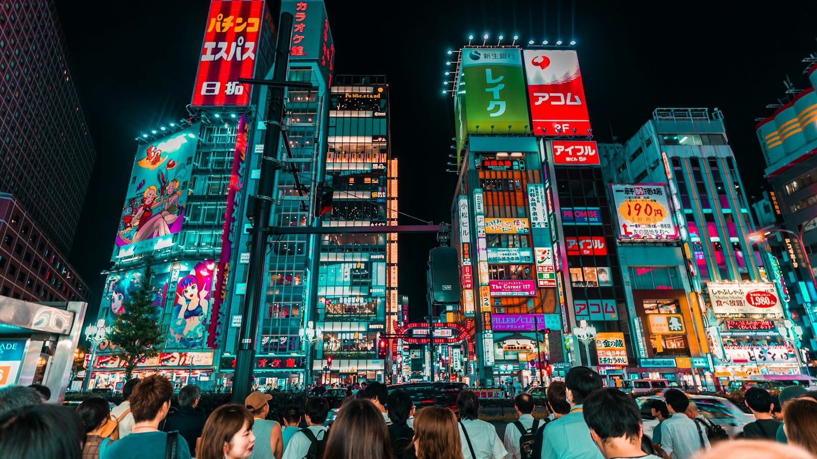 group of people watching lighted clear, red, and green high-rise building