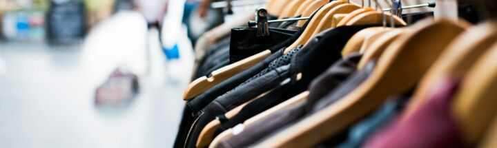 selective focus photography of hanged clothes