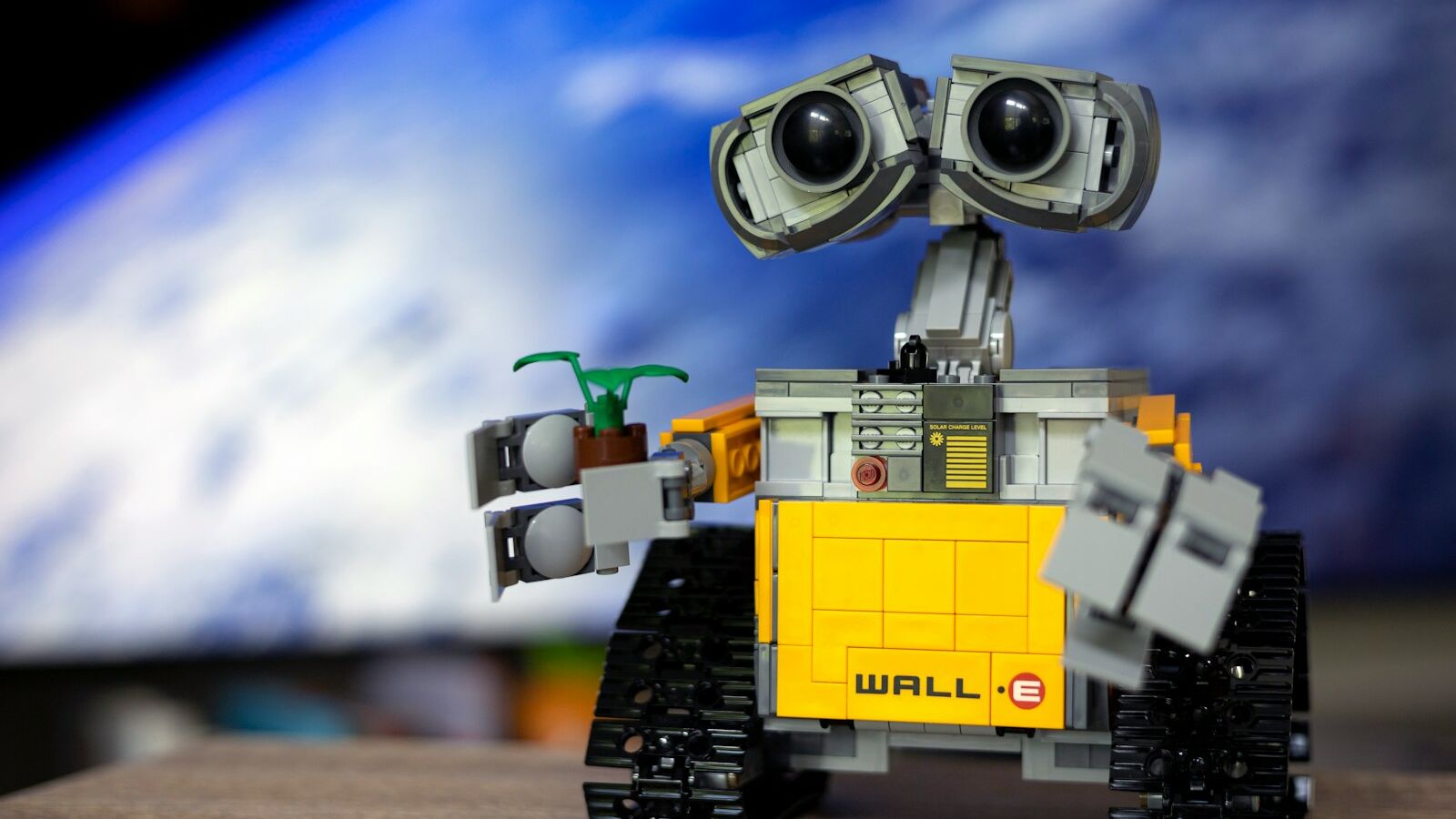a lego robot with two eyes and a camera
