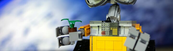 a lego robot with two eyes and a camera