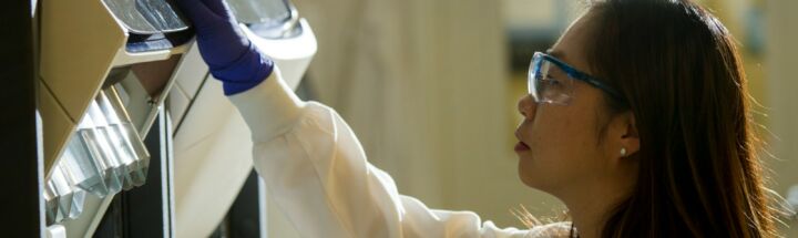 woman in white long sleeve shirt wearing black framed eyeglasses