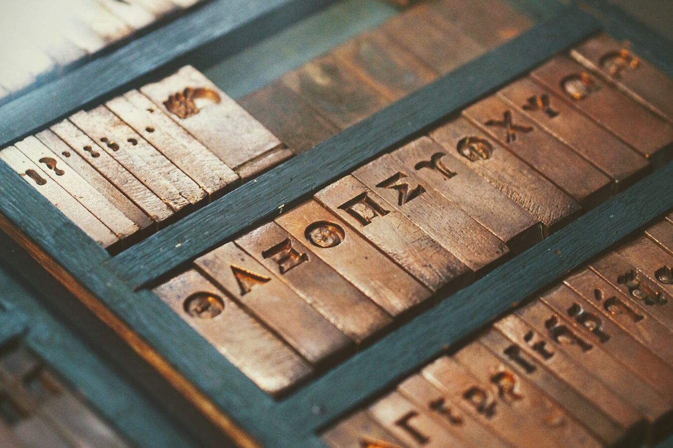 brass letter plates in black wooden box