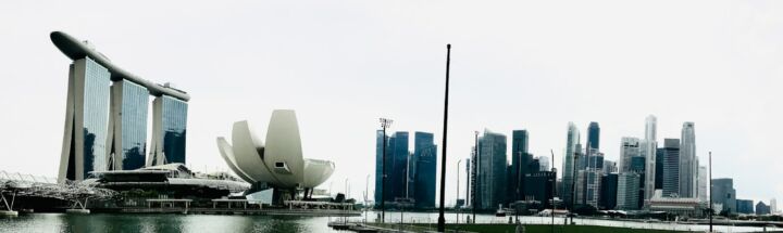 a large body of water with a city in the background
