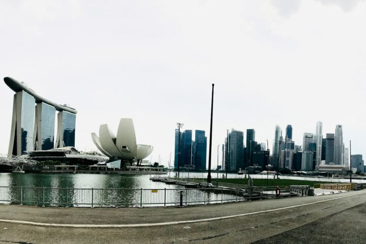 a large body of water with a city in the background