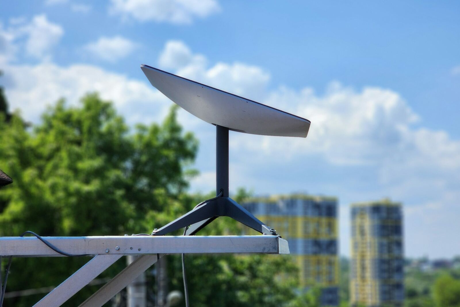 a white surfboard sitting on top of a metal pole