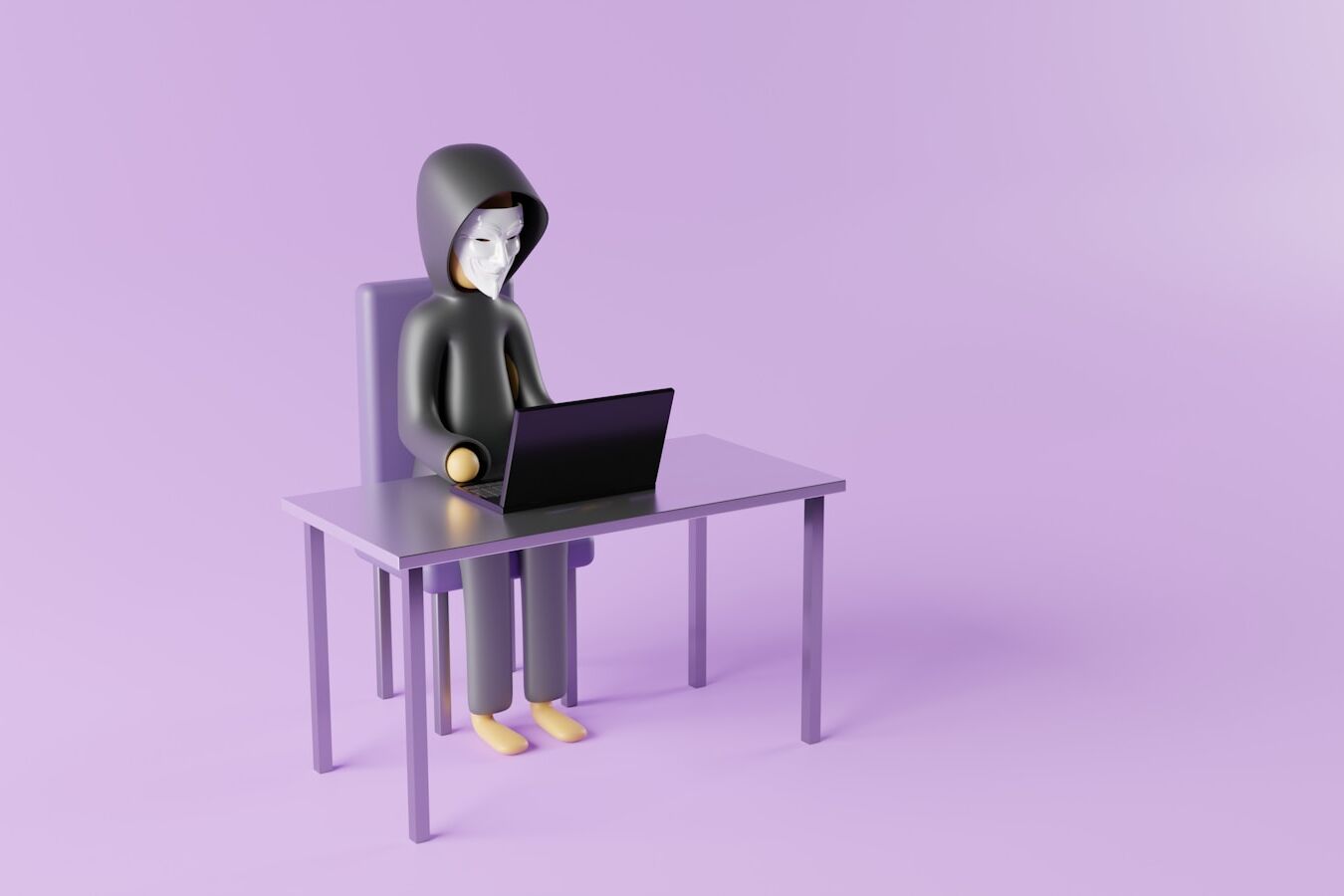 a person sitting at a desk with a laptop on it