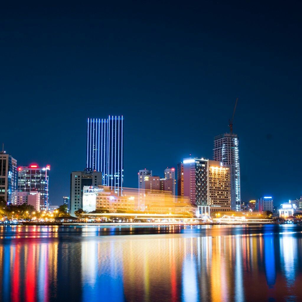 city buildings beside body of water