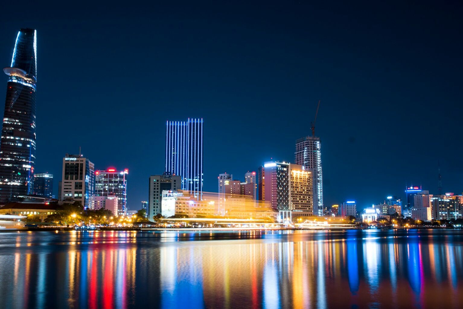 city buildings beside body of water