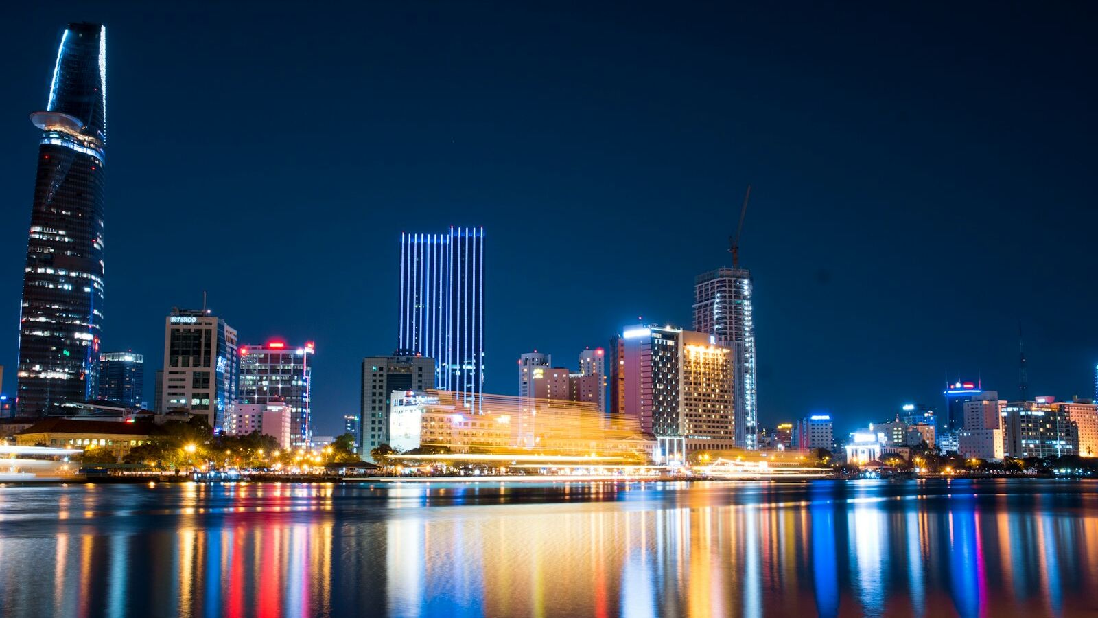 city buildings beside body of water