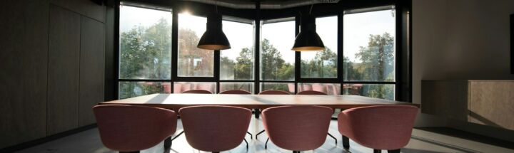 pink dining table with four chairs inside room
