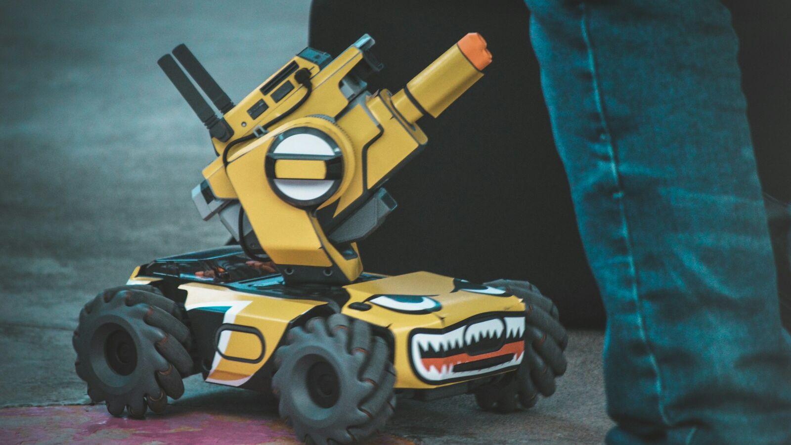 yellow and black 4-wheeled robot vehicle toy