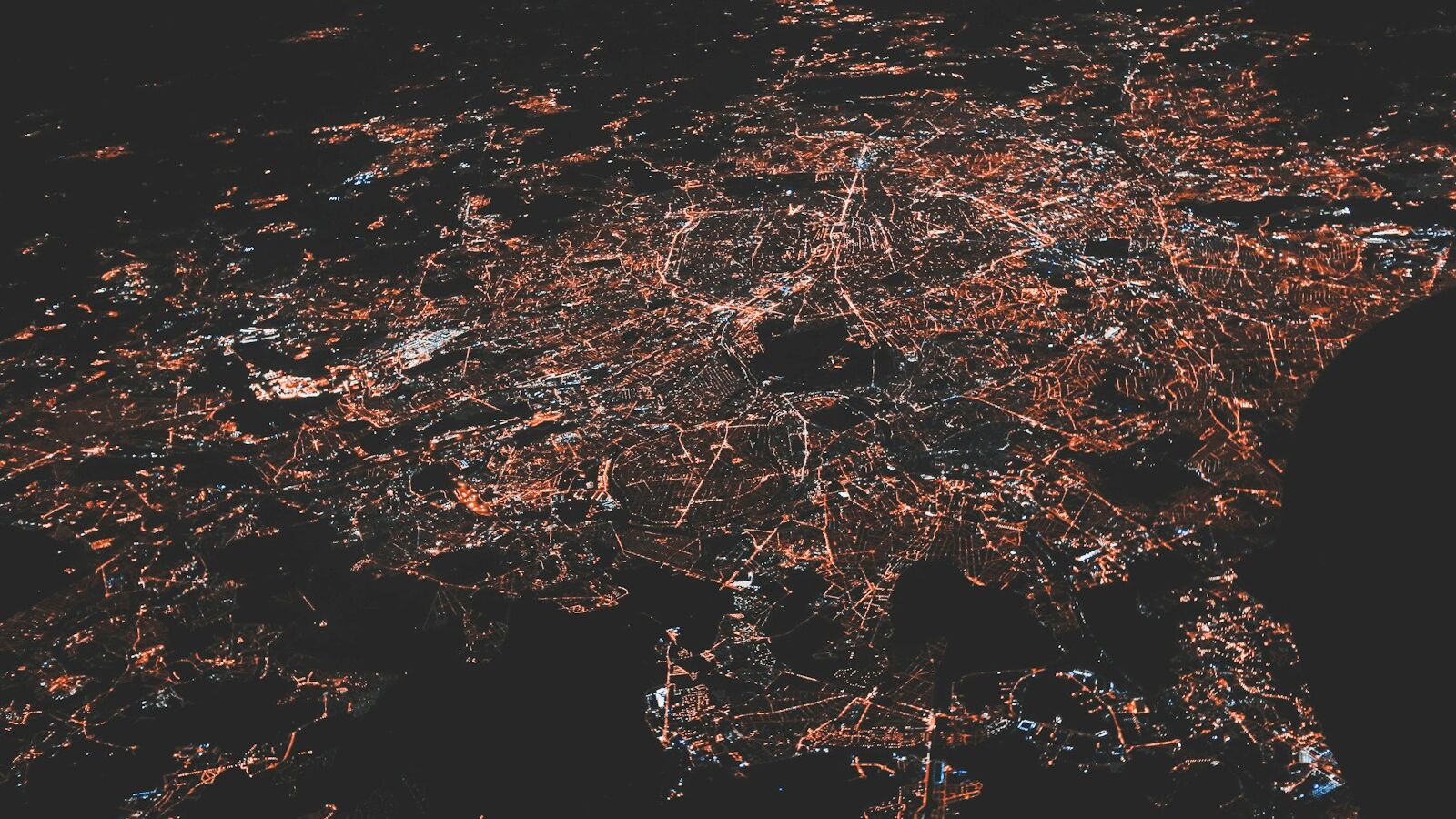 lighted city at night aerial photo