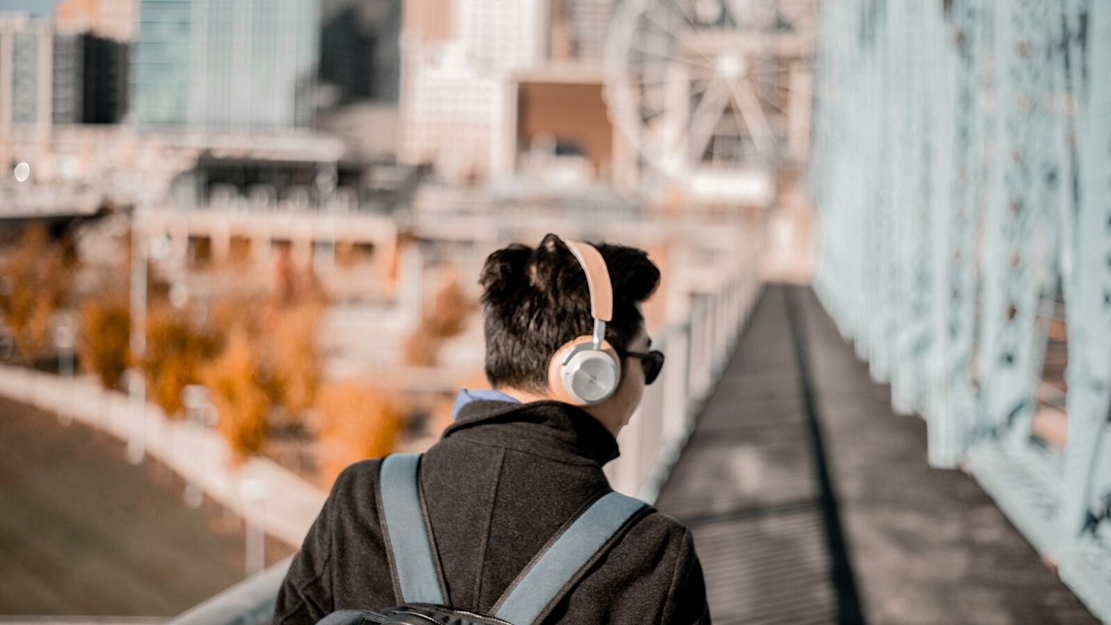 man wearing brown cordless headphones