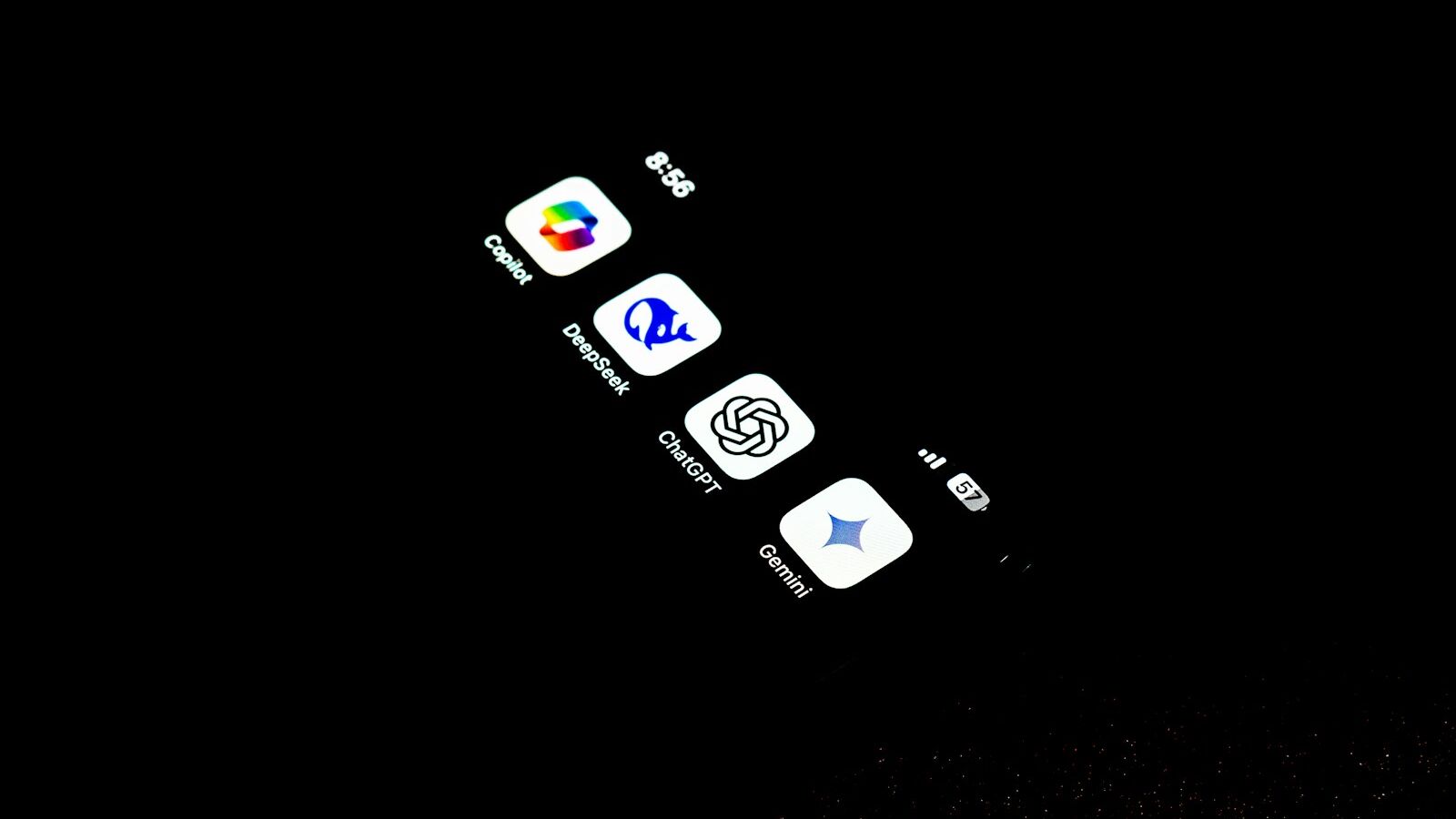 A cell phone that is lit up in the dark