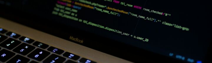 MacBook Pro with images of computer language codes