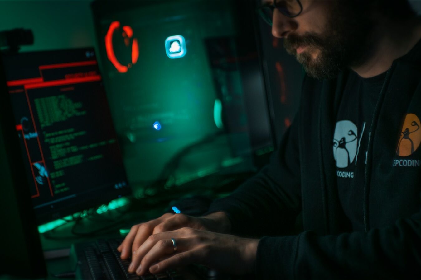 man in black jacket using computer