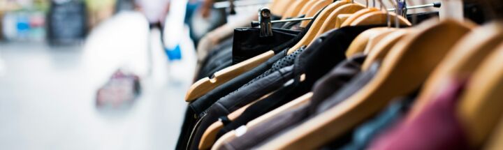 selective focus photography of hanged clothes