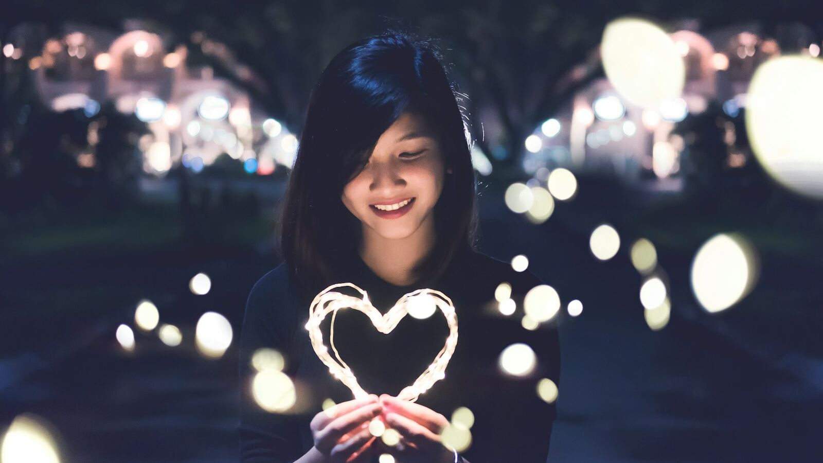 A woman holding a heart