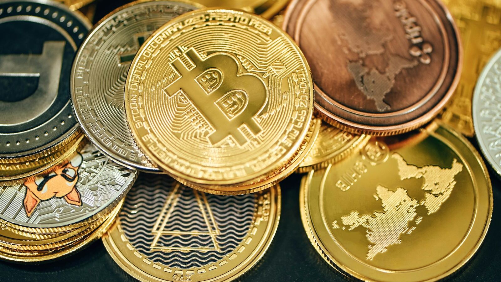 a pile of gold and silver bitcoins