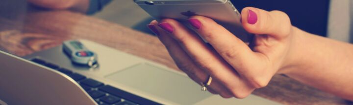 woman holding silver iPhone 6