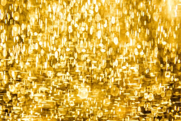 a yellow background with lots of small circles