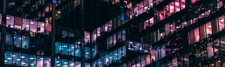 architectural photography of building with people in it during nighttime
