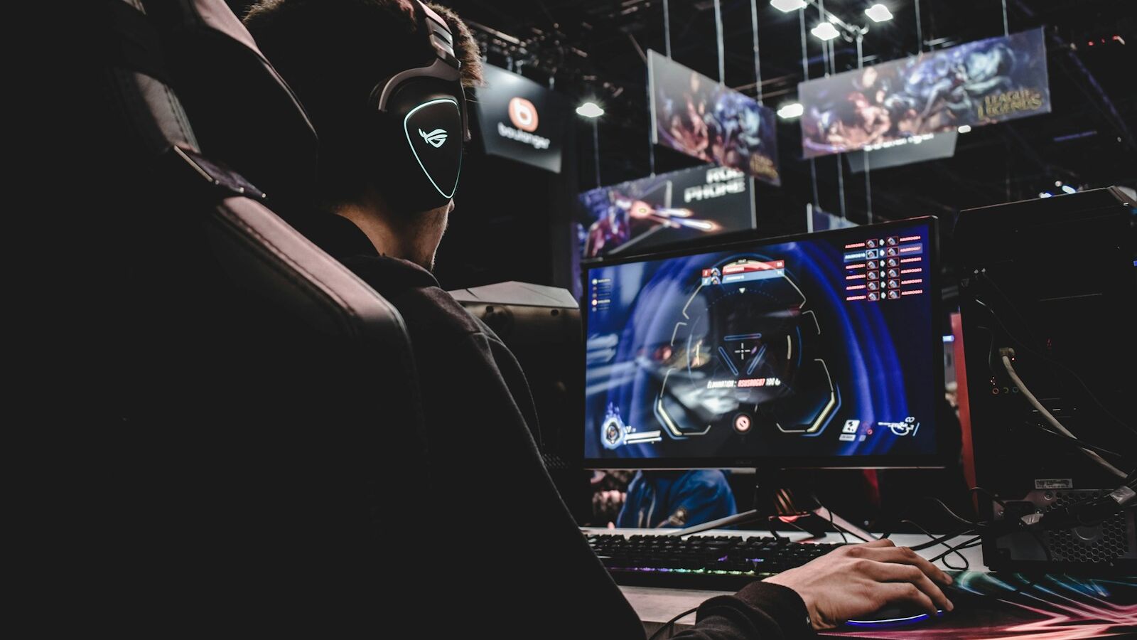 person sitting on gaming chair while playing video game