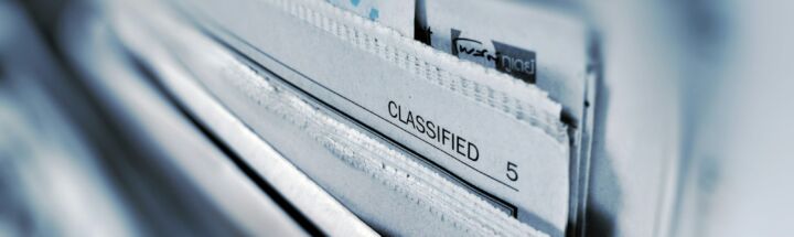 Classified page 5 newspaper selective focus photography