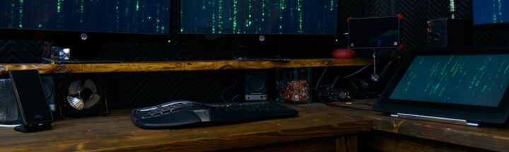 black computer keyboard on brown wooden desk