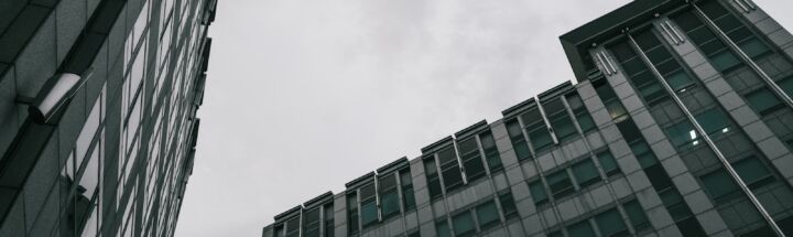 a couple of tall buildings sitting next to each other