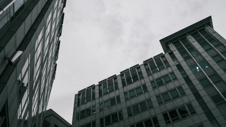 a couple of tall buildings sitting next to each other