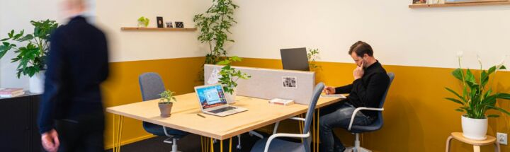 man in black long sleeve shirt sitting on chair