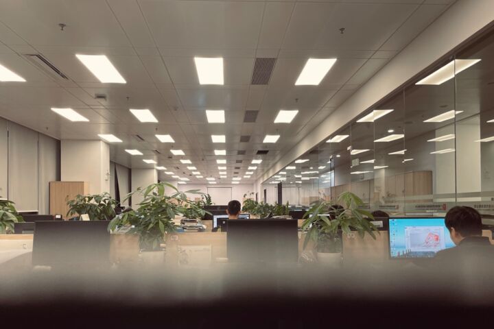 a man sitting at a desk in an office