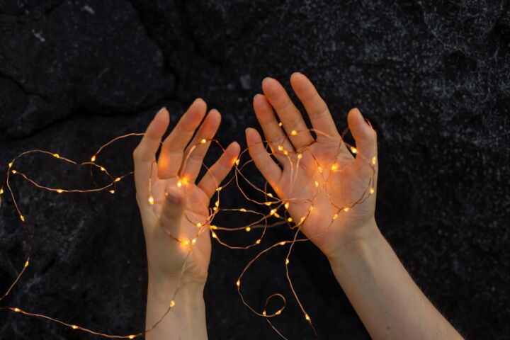 persons left hand with silver ring