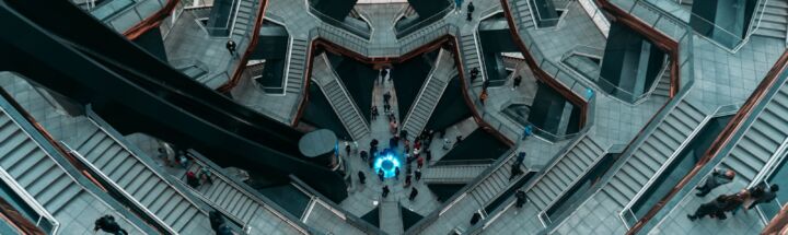 people walking on gray and white concrete building