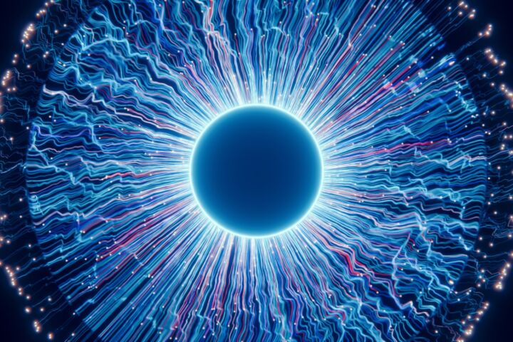 A close up of a blue eyeball in the dark